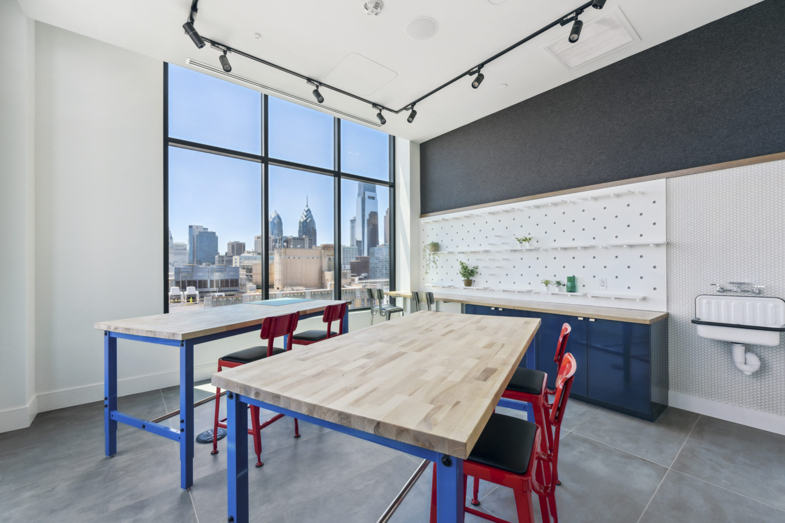 An image of desks in a community space of an apartment building.