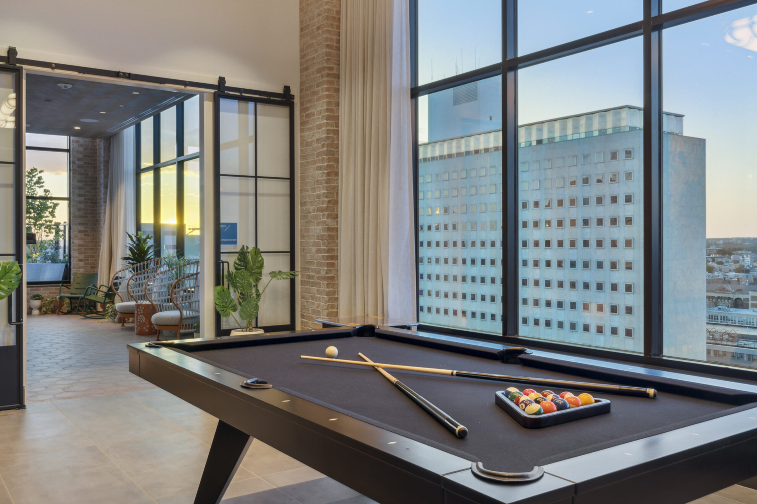 Image of a pool table in a community space of an apartment building.